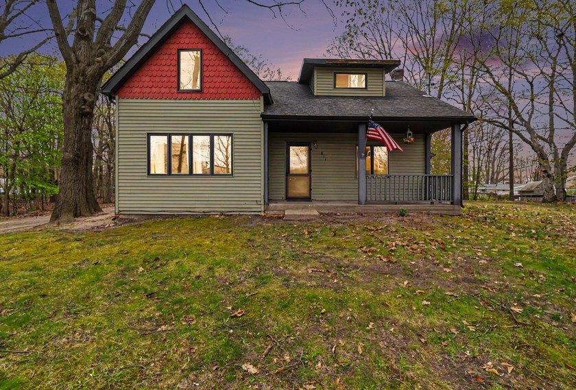 This 3 bedroom, 2 bath home just a little over a mile from the - Beach Home for sale in Ludington, Michigan on Beachhouse.com