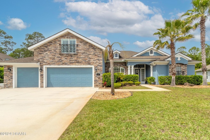 This exceptional pool home, boasting a well-maintained interior - Beach Home for sale in Ormond Beach, Florida on Beachhouse.com
