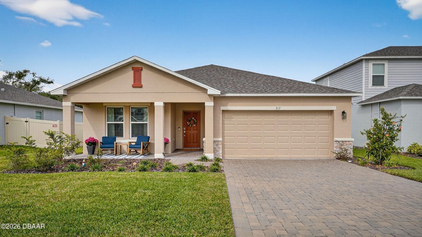 This like-new four-bedroom, three-bath single-family home offers - Beach Home for sale in Edgewater, Florida on Beachhouse.com