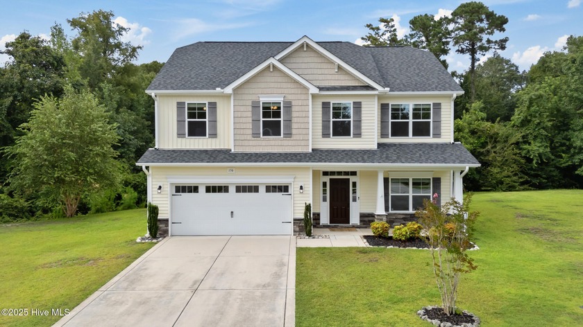 Extending a warm welcome to 156 Poplar Branch Way! This home - Beach Home for sale in Hampstead, North Carolina on Beachhouse.com