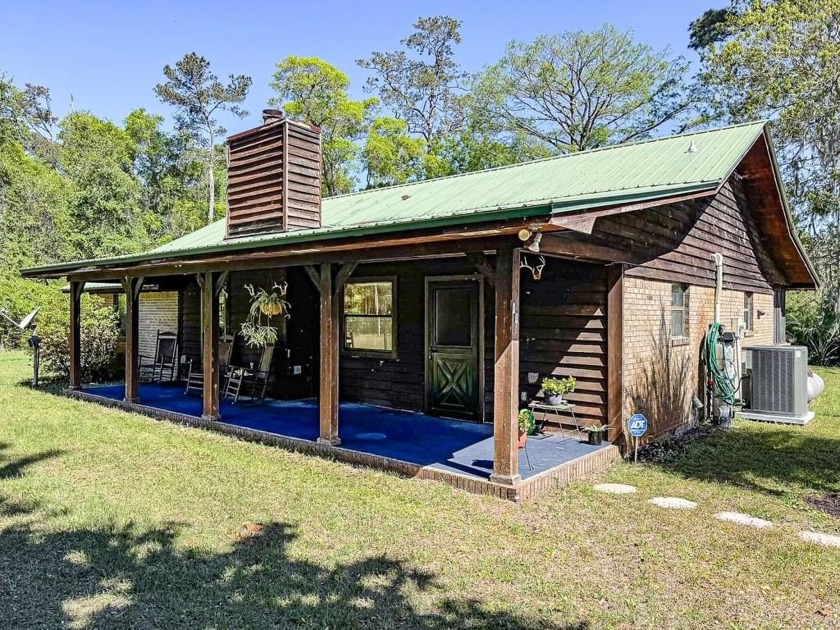 Nestled on a scenic bend of the Sopchoppy River, this 2-bedroom - Beach Home for sale in Sopchoppy, Florida on Beachhouse.com