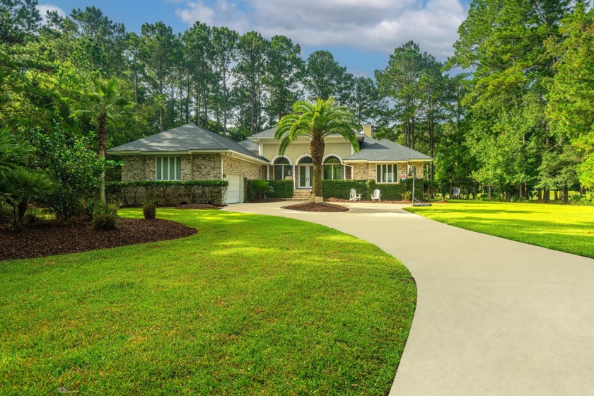 Nestled on a 1 + acre estate & overlooking the 2nd green, this - Beach Home for sale in Mount Pleasant, South Carolina on Beachhouse.com