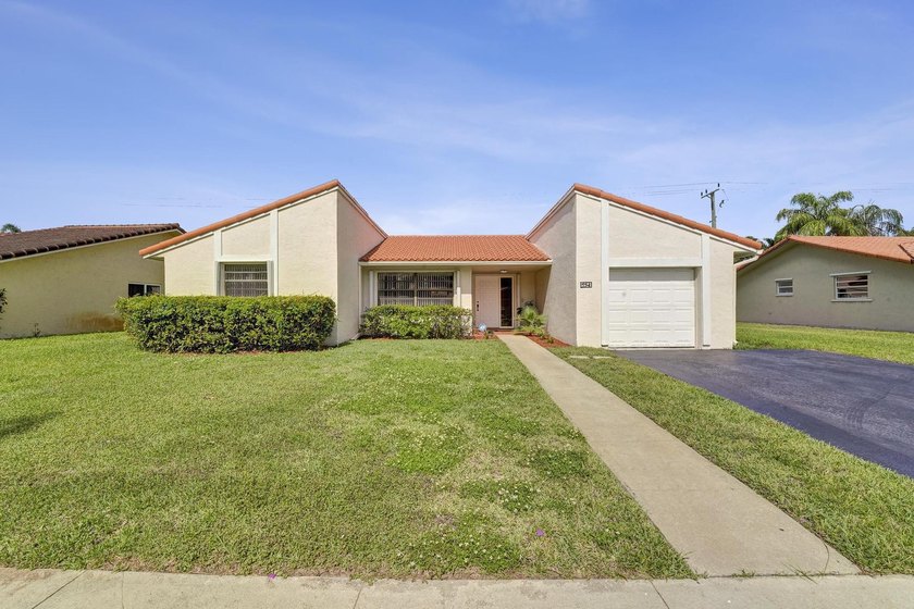 Welcome to this bright and spacious 3-bed, 2-bath home in highly - Beach Home for sale in Cooper City, Florida on Beachhouse.com