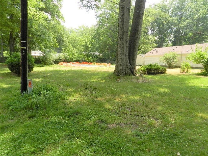 This lot faces a wooded area and is centrally located near - Beach Lot for sale in Coloma, Michigan on Beachhouse.com