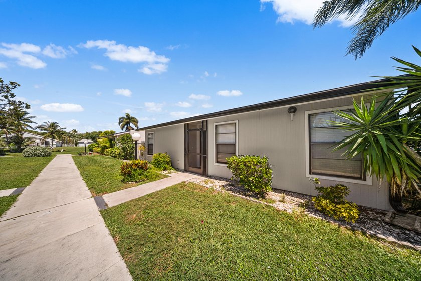 This spacious one-story villa is ideally located in the heart of - Beach Home for sale in West Palm Beach, Florida on Beachhouse.com