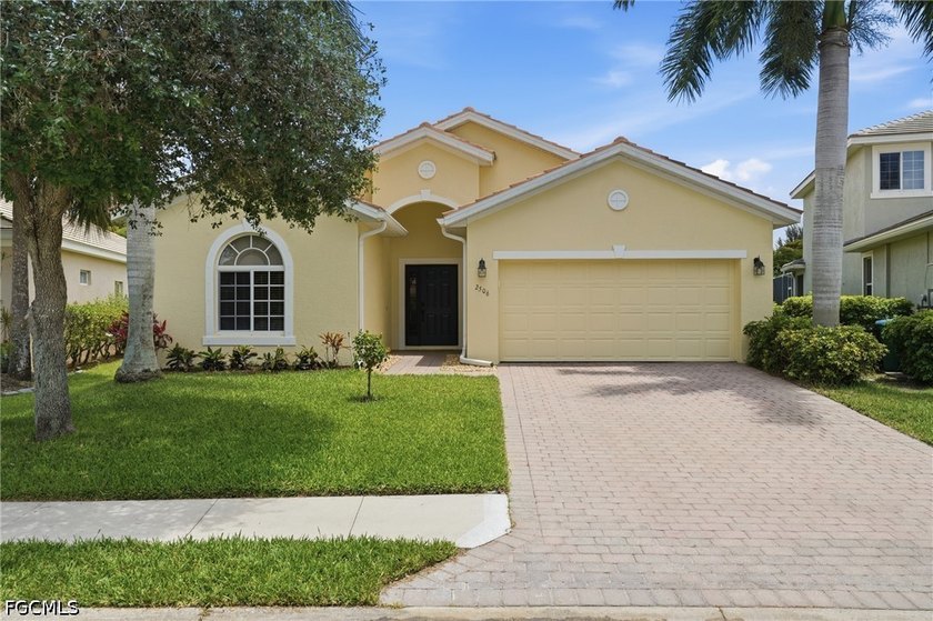 This stunning Mediterranean-inspired home offers incredible curb - Beach Home for sale in Cape Coral, Florida on Beachhouse.com