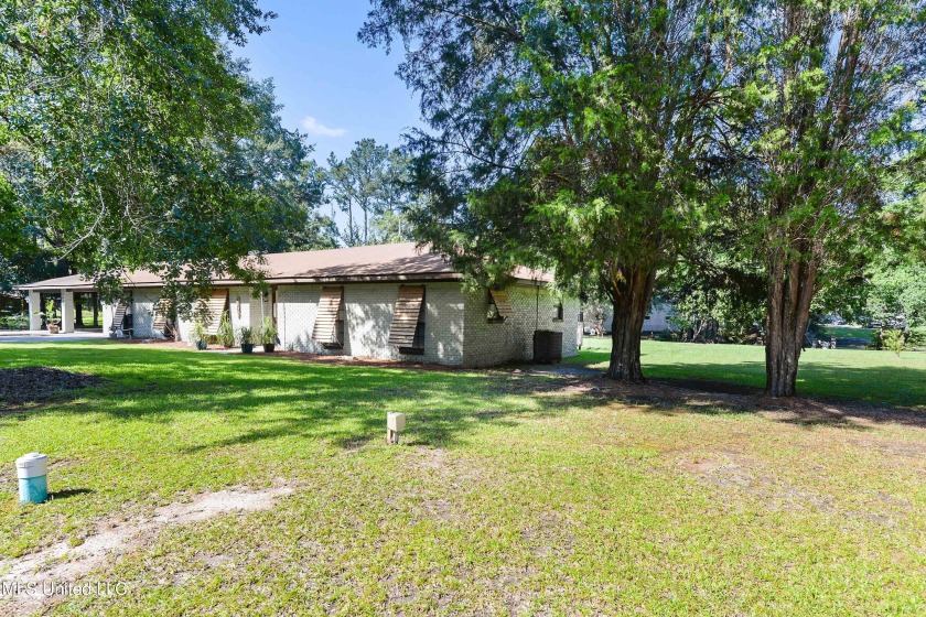 Your river retreat awaits!  Nestled on over an acre of gorgeous - Beach Home for sale in Moss Point, Mississippi on Beachhouse.com