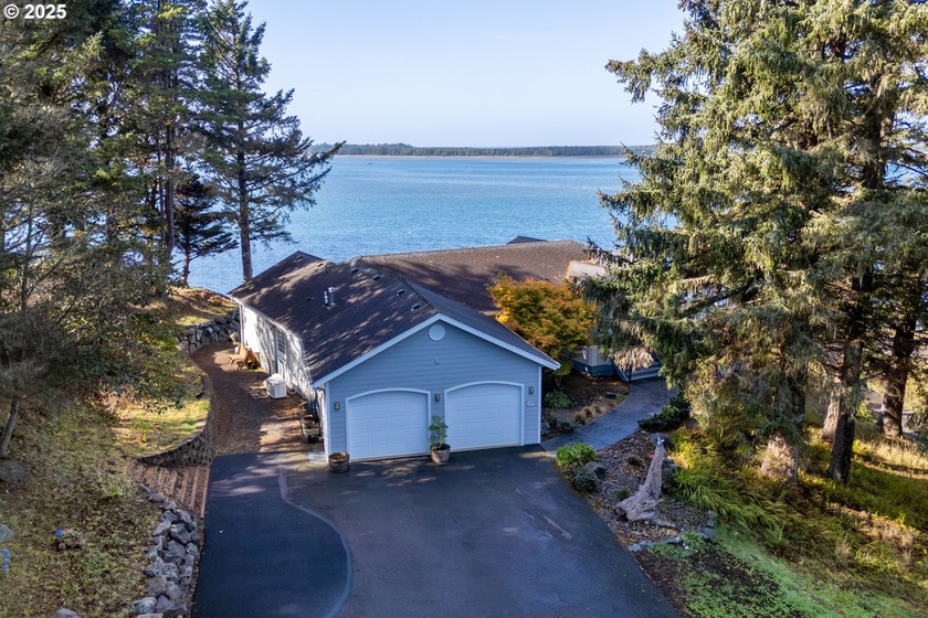 Perched high above the water's edge, this exceptional Netarts - Beach Home for sale in Netarts, Oregon on Beachhouse.com
