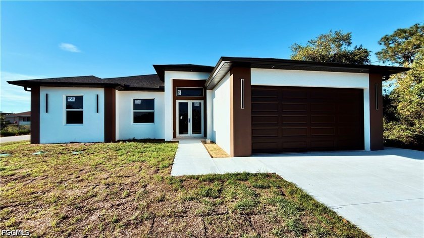 Welcome to this meticulously crafted new construction home with - Beach Home for sale in Lehigh Acres, Florida on Beachhouse.com