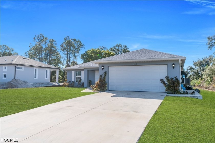 Beautiful 3-bedroom, 2-bath home featuring a bright open-concept - Beach Home for sale in Lehigh Acres, Florida on Beachhouse.com