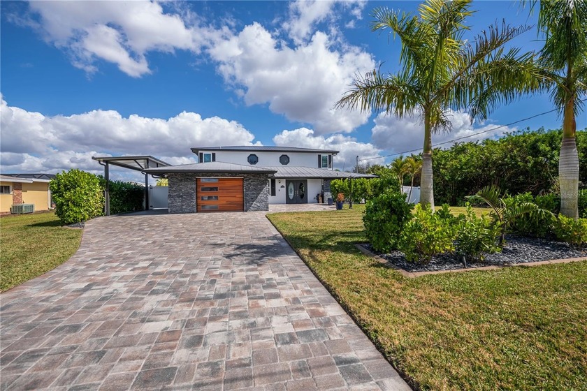 Modern waterfront luxury with DIRECT BOATING ACCESS -- a PRIVATE - Beach Home for sale in Punta Gorda, Florida on Beachhouse.com