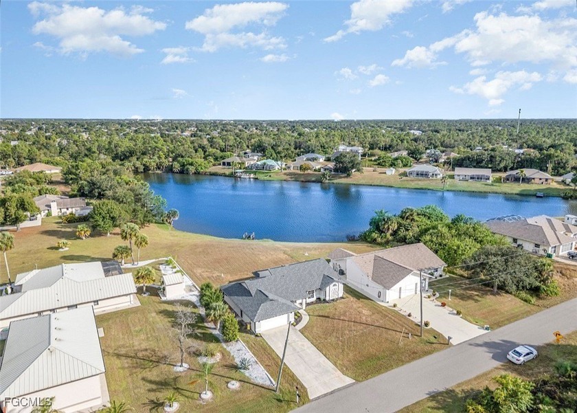 Just listed on an OVERSIZED LAKEFRONT LOT, this remarkable home - Beach Home for sale in Port Charlotte, Florida on Beachhouse.com