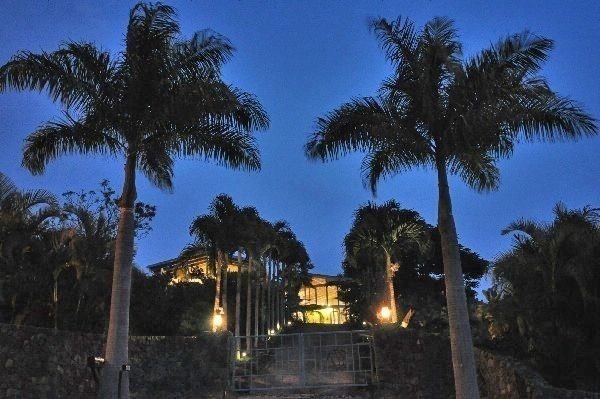 Enter via a gated Palm Tree lined drive to a dramatic custom - Beach Home for sale in Kailua Kona, Hawaii on Beachhouse.com