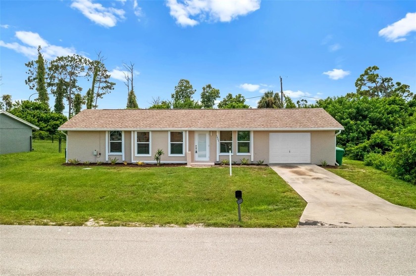 Welcome to 1057 Tropical Ave NW, a beautifully updated home - Beach Home for sale in Port Charlotte, Florida on Beachhouse.com