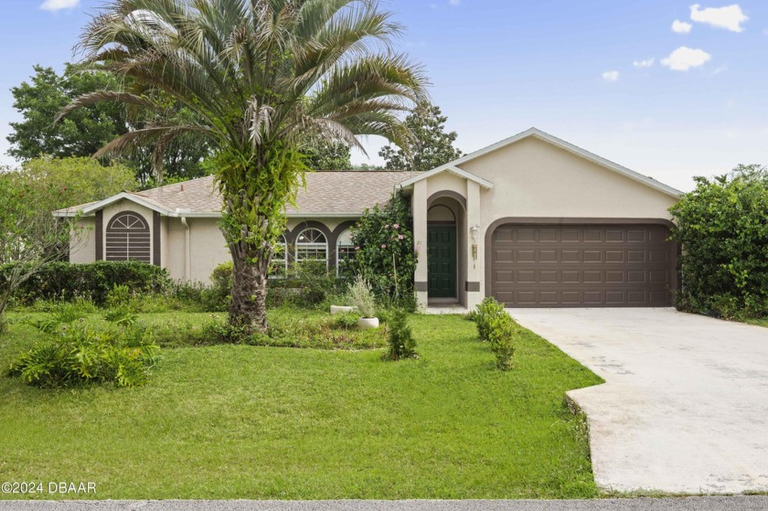 Welcome home to this charming 4-bedroom, 2-bathroom home - Beach Home for sale in Palm Coast, Florida on Beachhouse.com