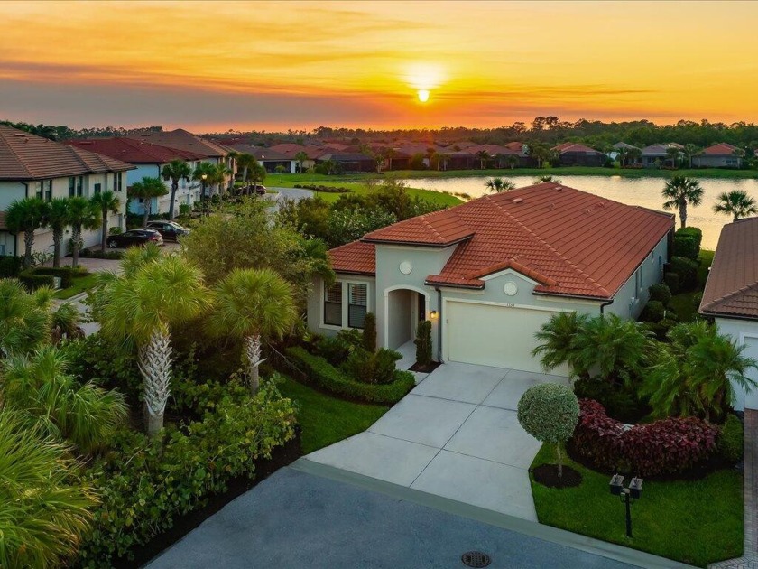 Magnificent lake and sunset views accent this stunning three - Beach Home for sale in Naples, Florida on Beachhouse.com