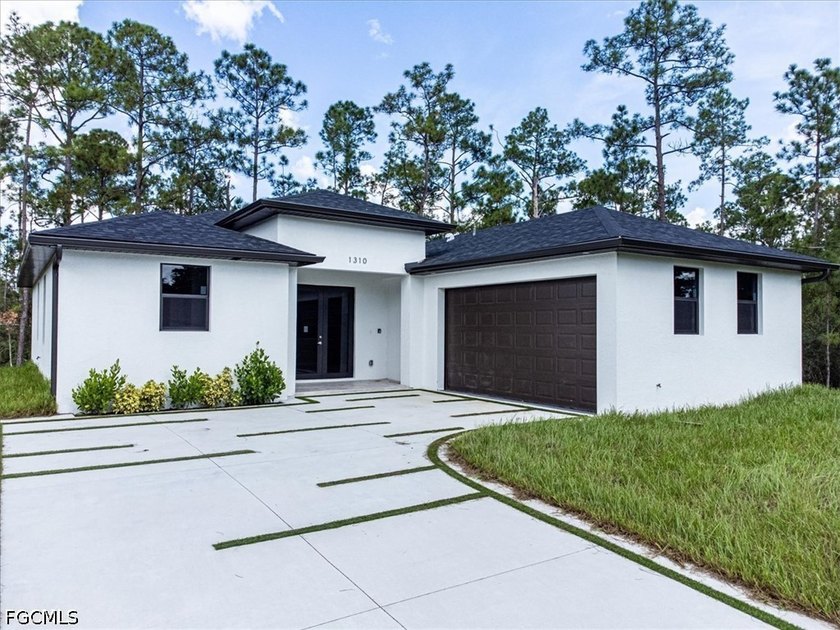 Beautiful Modern, on a spacious 1/2-acre lot, this beautifully - Beach Home for sale in Lehigh Acres, Florida on Beachhouse.com
