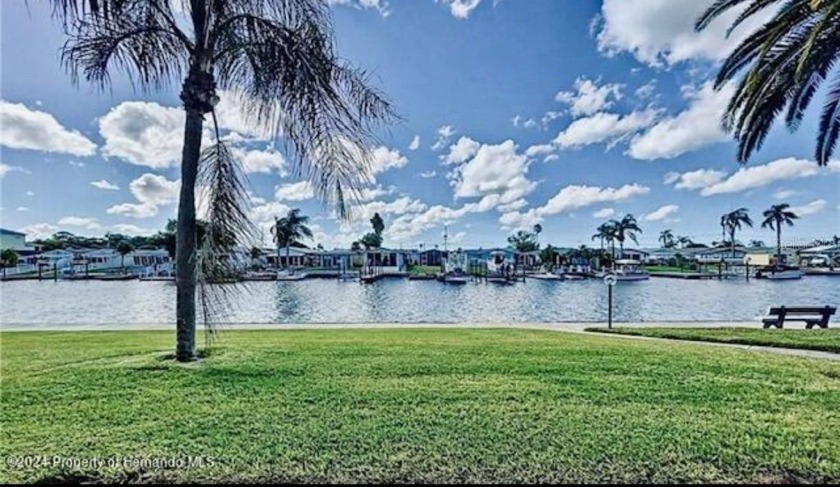 Experience the tranquility of waterfront living in this charming - Beach Condo for sale in New Port Richey, Florida on Beachhouse.com