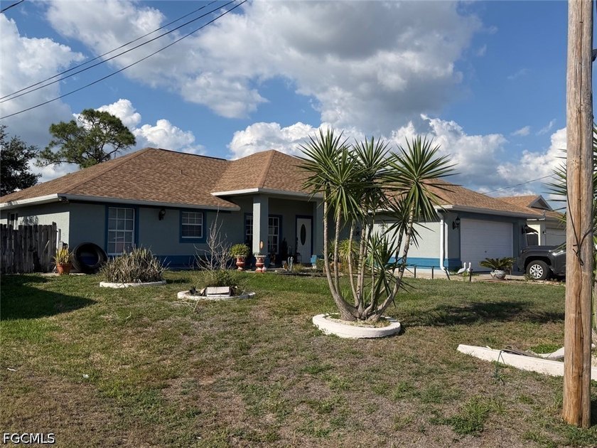 Step into this stunning 4-bedroom, 2-bathroom home that combines - Beach Home for sale in Lehigh Acres, Florida on Beachhouse.com