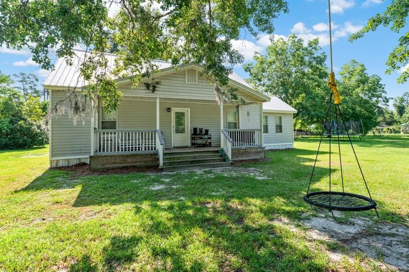 This charming 4-bedroom, 1.5-bath home is perfectly located - Beach Home for sale in Wewahitchka, Florida on Beachhouse.com