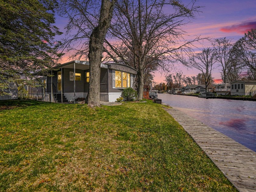 Charming 3-bedroom, 1.5-bath canal-front home in Tamarac Village - Beach Home for sale in Ludington, Michigan on Beachhouse.com