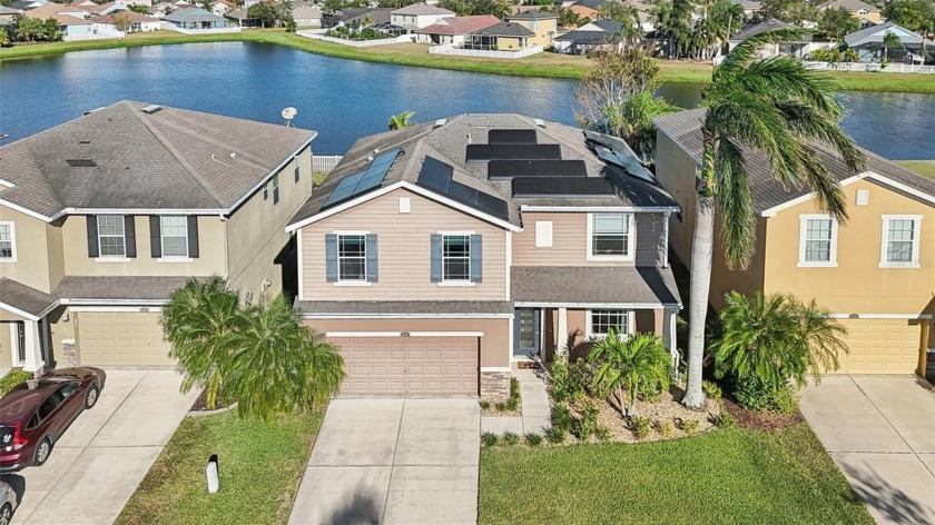 Charming 4-Bedroom Home with Scenic Pond Views in Mira Lago - Beach Home for sale in Ruskin, Florida on Beachhouse.com