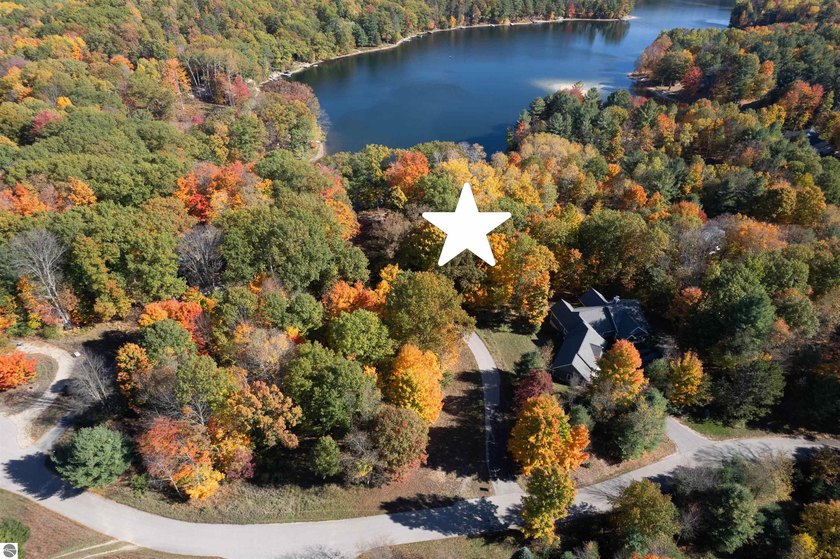 Tucked along the northwest shore of Chandler Lake, this 1 - Beach Lot for sale in Traverse City, Michigan on Beachhouse.com