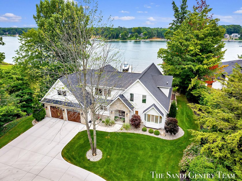 Welcome to this exceptional Waterfront Home on beautiful Spring - Beach Home for sale in Spring Lake, Michigan on Beachhouse.com