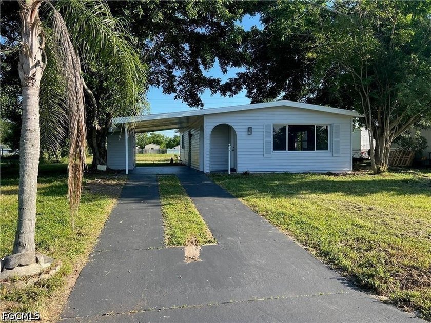 Discover this beautifully updated 2-bedroom, 2-bathroom concrete - Beach Home for sale in Lehigh Acres, Florida on Beachhouse.com