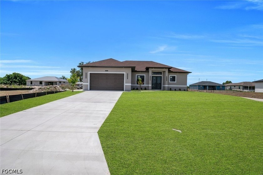 Welcome to this stunning modern NEW CONSTRUCTION home at 3115 - Beach Home for sale in Lehigh Acres, Florida on Beachhouse.com