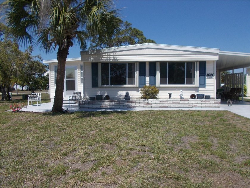 This is a 2-bedroom, 2 bath, Doublewide home located in the PET - Beach Home for sale in North Port, Florida on Beachhouse.com