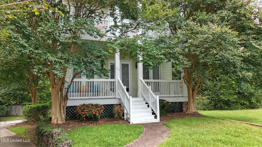 This two-story Coastal Southern Style home is nestled in a - Beach Home for sale in Gulfport, Mississippi on Beachhouse.com