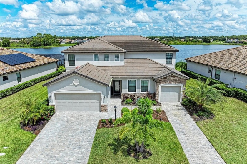 SPECTACULAR LAKE VIEW HOME-with two separate residences under - Beach Home for sale in Lakewood Ranch, Florida on Beachhouse.com