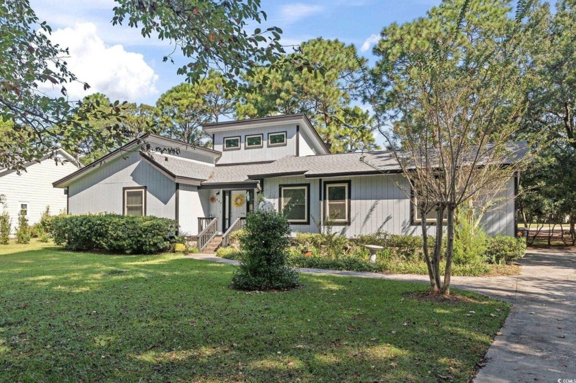 Welcome to your dream home! Nestled in the serene Litchfield - Beach Home for sale in Pawleys Island, South Carolina on Beachhouse.com