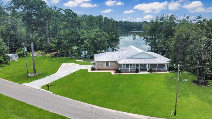 Lakefront living at its finest in the desirable Lands Landing - Beach Home for sale in Wewahitchka, Florida on Beachhouse.com