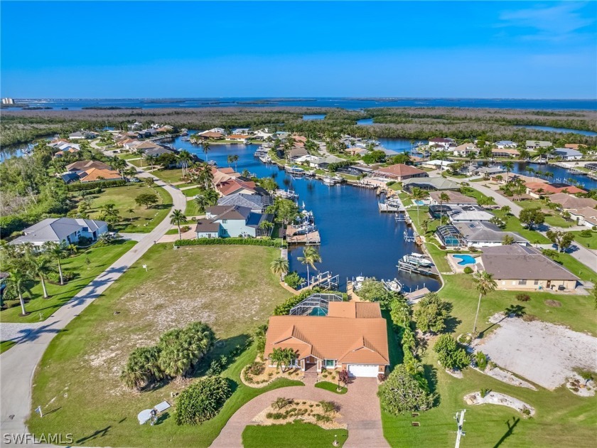 Situated on a wide gulf access canal in Palm Acres near Sanibel - Beach Home for sale in Fort Myers, Florida on Beachhouse.com