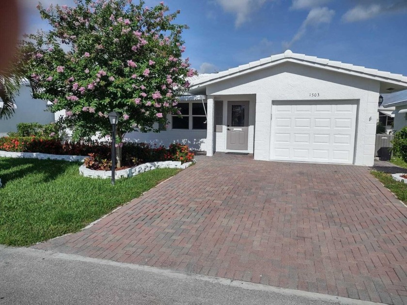 Welcome to this completely remodeled 3-bed, 2-bath home in a 55+ - Beach Home for sale in Boynton Beach, Florida on Beachhouse.com