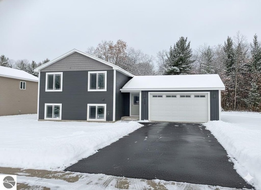Experience style and comfort in this brand-new 3-bedroom, 2-bath - Beach Home for sale in Traverse City, Michigan on Beachhouse.com