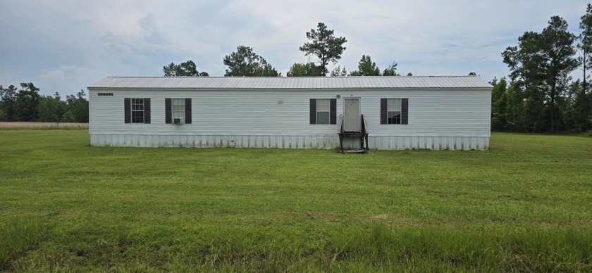 PRICED TO SELL!! 10 ACRES with mobile home! Discover the charm - Beach Home for sale in Wewahitchka, Florida on Beachhouse.com