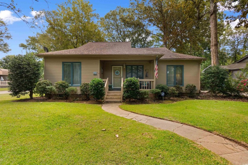 Welcome to this charming furnished 3-bedroom home situated on a - Beach Home for sale in Murrells Inlet, South Carolina on Beachhouse.com