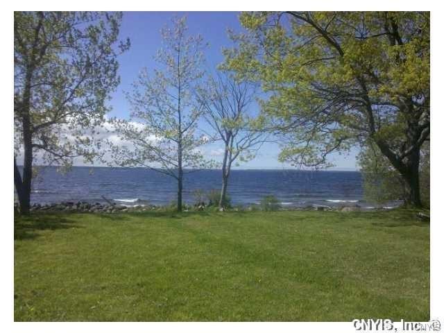 Absolutely stunning and rare lakefront lot boasting over 400' of - Beach Lot for sale in Dexter, New York on Beachhouse.com
