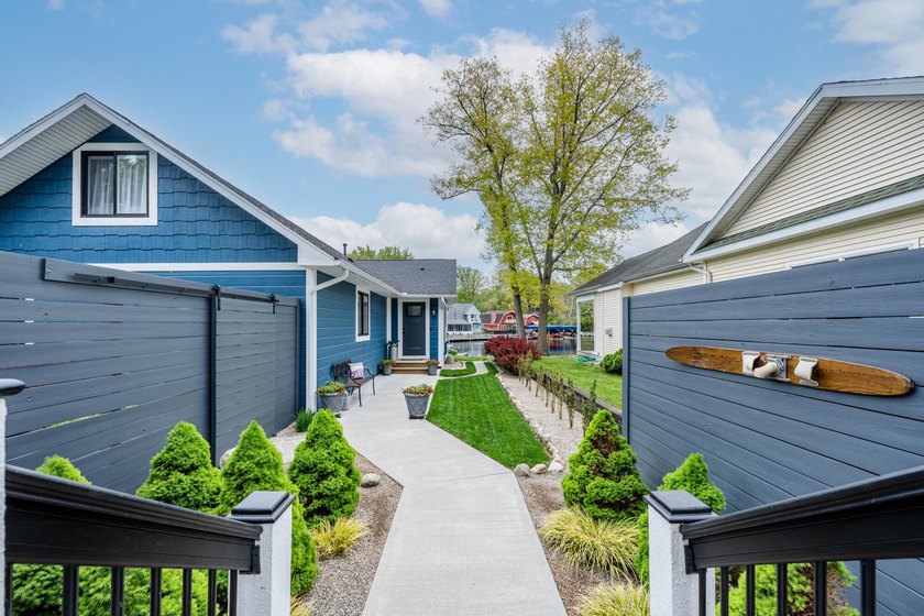 Nestled along the shores of beautiful Paw Paw Lake, this - Beach Home for sale in Coloma, Michigan on Beachhouse.com