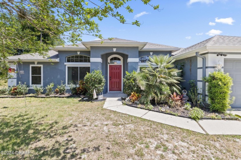 Welcome to this charming 4-bedroom, 2-bathroom pool home - Beach Home for sale in Palm Coast, Florida on Beachhouse.com