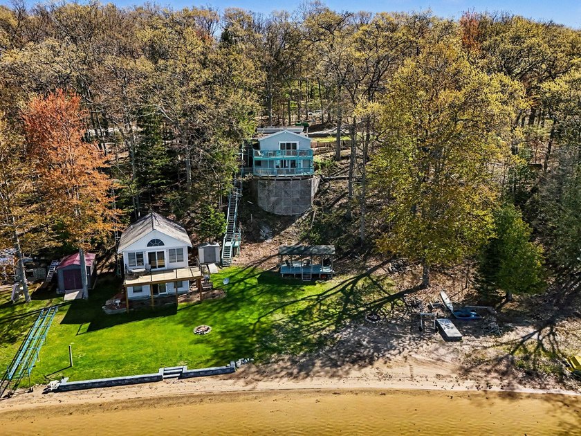 Vintage cabin meets modern lake living on Gunn Lake, a 219-acre - Beach Home for sale in Free Soil, Michigan on Beachhouse.com