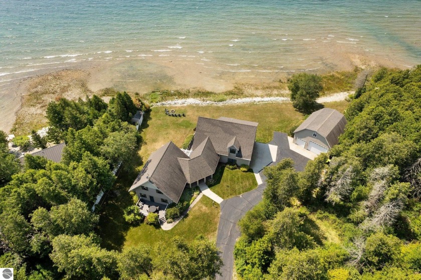 Welcome home to a custom-built 6 bed/3 bath masterpiece with - Beach Home for sale in St Ignace, Michigan on Beachhouse.com