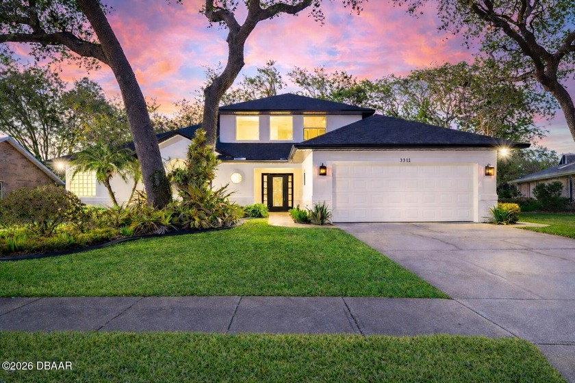 Set on an expansive golf course lot with mature, lush - Beach Home for sale in Port Orange, Florida on Beachhouse.com