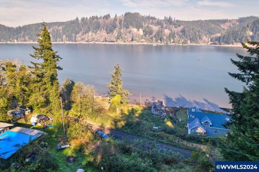 Discover tranquility on this stunning .69-acre hidden gem on - Beach Lot for sale in Toledo, Oregon on Beachhouse.com