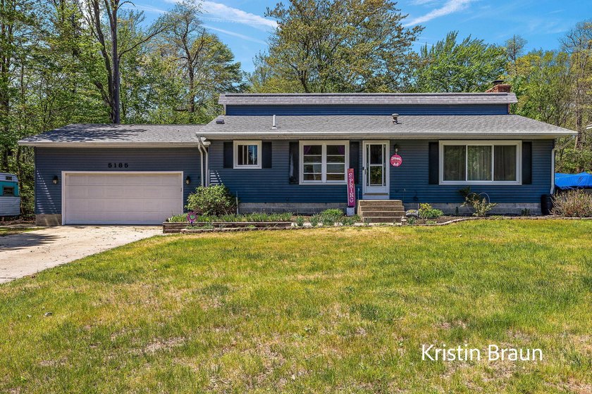 Welcome to this well-maintained quad-level home located in the - Beach Home for sale in Norton Shores, Michigan on Beachhouse.com
