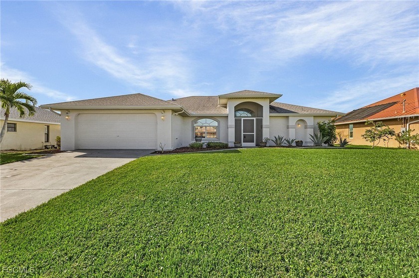 Nestled along a peaceful freshwater canal, this inviting - Beach Home for sale in Cape Coral, Florida on Beachhouse.com