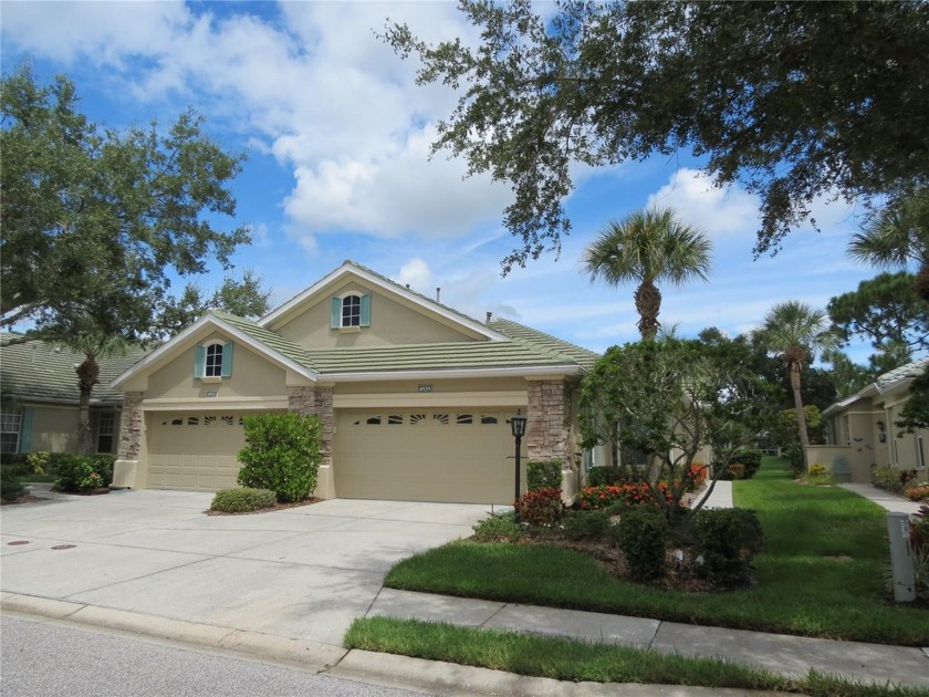 Tranquil, Lakefront, Maintenance Free paired Villa nestled in - Beach Home for sale in Sarasota, Florida on Beachhouse.com